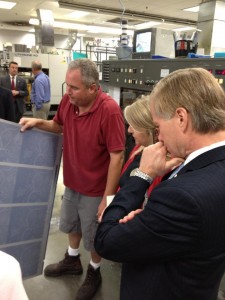 Governor and Mrs. Bob McDonnell inspect the book's pages as they come off the press.